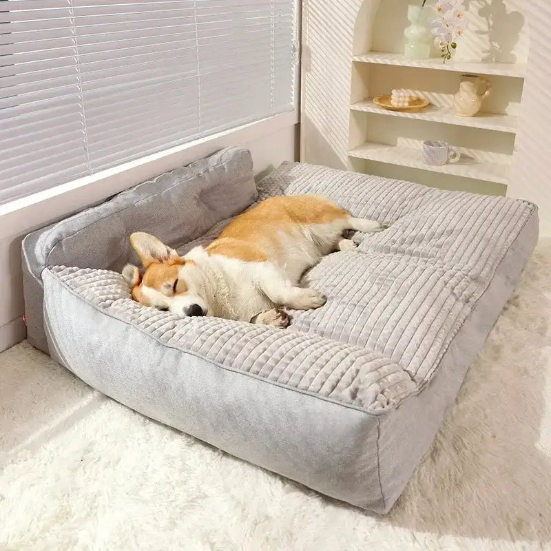 A dog peacefully sleeping on a gray-coloured L-shape dog bed, highlighting its soft texture and modern design.