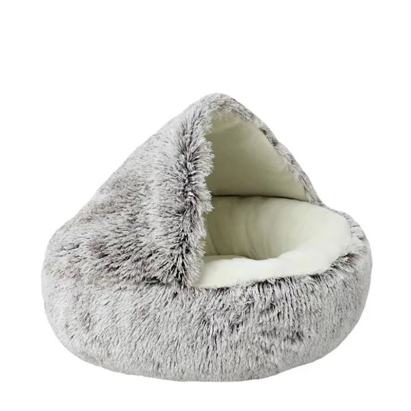 A cozy hooded cat bed in grey, perfect for cats to curl up and relax in. The bed features a soft, plush exterior and a warm, comfortable interior.