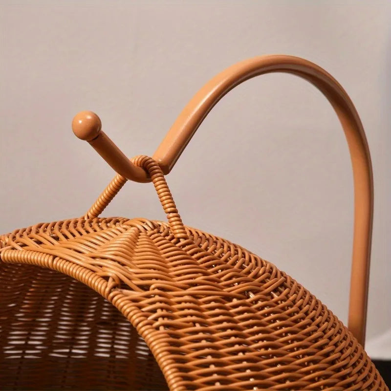 Detail of the rattan cat swing bed showing the durable rope and metal arm used to securely suspend the hammock.